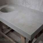 Concrete countertop with integrated wine bar cement sink and weathered finish hi spray