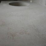 Concrete countertop with integrated wine bar sink and weathered finish hi spray cement
