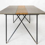 Dining table, hand crafted from wood concrete and steel.The "criss-cross" legs add a stunning depth to the unique design.