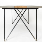 Dining table, hand crafted from wood concrete and steel.The "criss-cross" legs add a stunning depth to the unique design.