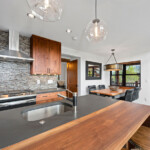 Rustic modern walnut and concrete waterfall countertop. Collaboration with Concrete Pete