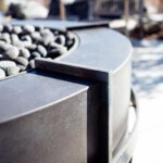 Modern industrial design concrete and steel firepit overlooking Steamboat springs CO Modern industrial design, concrete and steel firepit overlooking Steamboat springs CO
