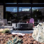 Modern industrial design, concrete and steel fire pit overlooking Steamboat springs CO