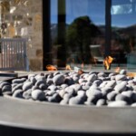 Modern industrial design, concrete and steel fire pit overlooking Steamboat springs CO